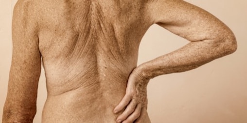 Bare skin shown of a person’s back