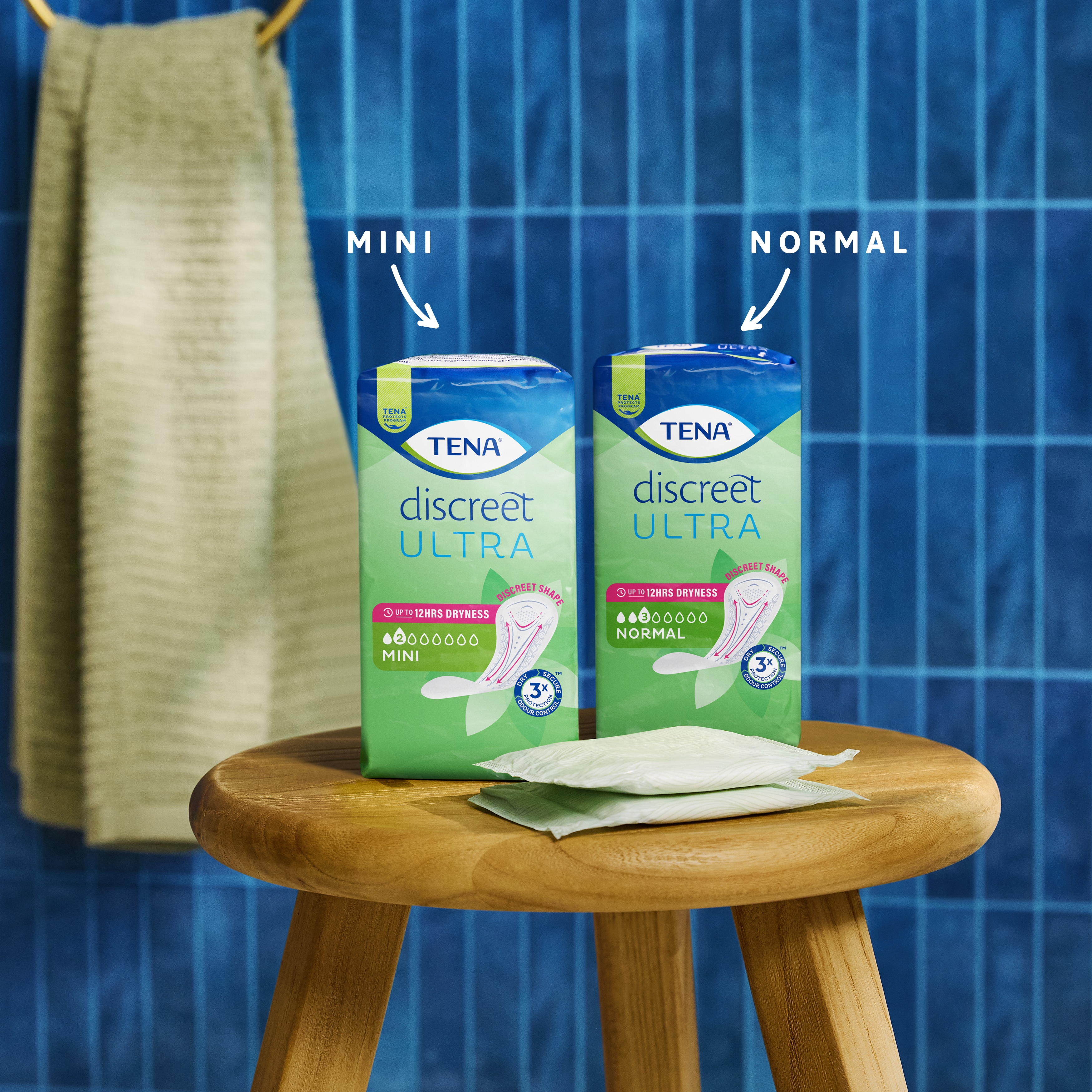 Packs of TENA Discreet Ultra Pad Mini and Normal on a table