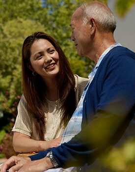 Woman kissed by carer