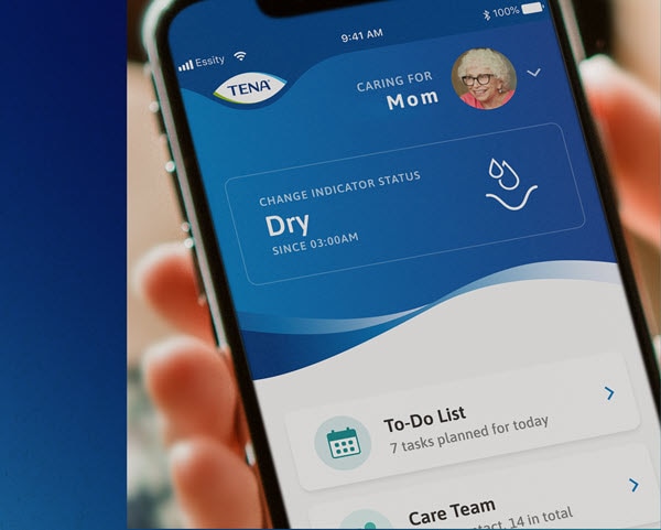Een smartphone toont de verschillende meldingen in de TENA SmartCare Professional Care-app