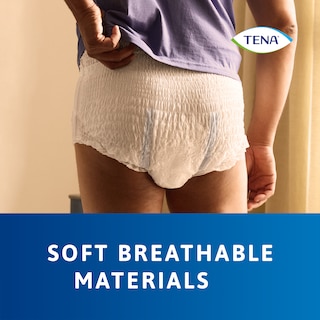 Wearing the TENA Pants protect+ on body without clothes, demonstrating the soft breathable materials of the product.