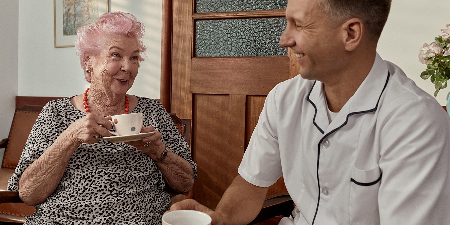 TENA-Lifestyle-old-woman-drinking-coffee-with-nurse_2-1.jpg                                                                                                                                                                                                                                                                                                                                                                                                                                                         