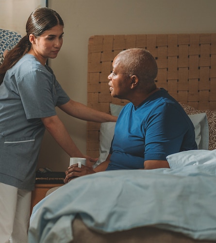 A male doctor speaks to a patient