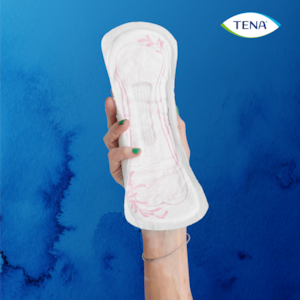 Holding a TENA Discreet Extra in the hand 