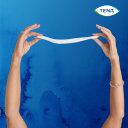 Showing the thinness of TENA Discreet Extra incontinence pad