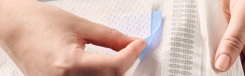 Discover TENA ProSkin Flex with Fingerlift™, a tab to easily find the belt opening