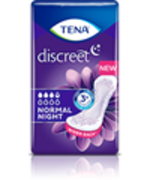 A woman wearing a nightgown is about to go to bed. 