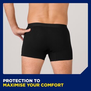 Close up image from behind of a man wearing the TENA washable underwear. The caption at the bottom of the image says "protection to maximise your comfort".