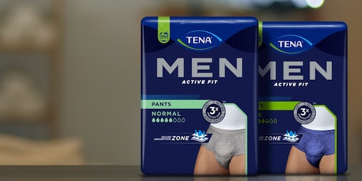 Pack shots of TENA pants in grey and blue