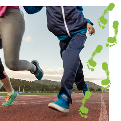 Two people running on a track with a trail green footprints over the image Two people running on a track with a trail green footprints over the image