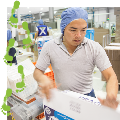 TENA factory worker closing a package TENA factory worker closing a package