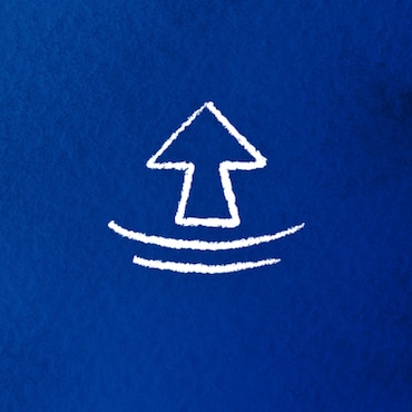 An image of an arrow pointing up on a blue background An image of an arrow pointing up on a blue background
