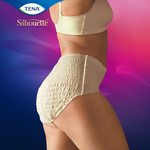 A woman wearing TENA Silhouette Creme seen from the side

