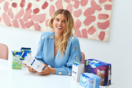 Ashley James with TENA products