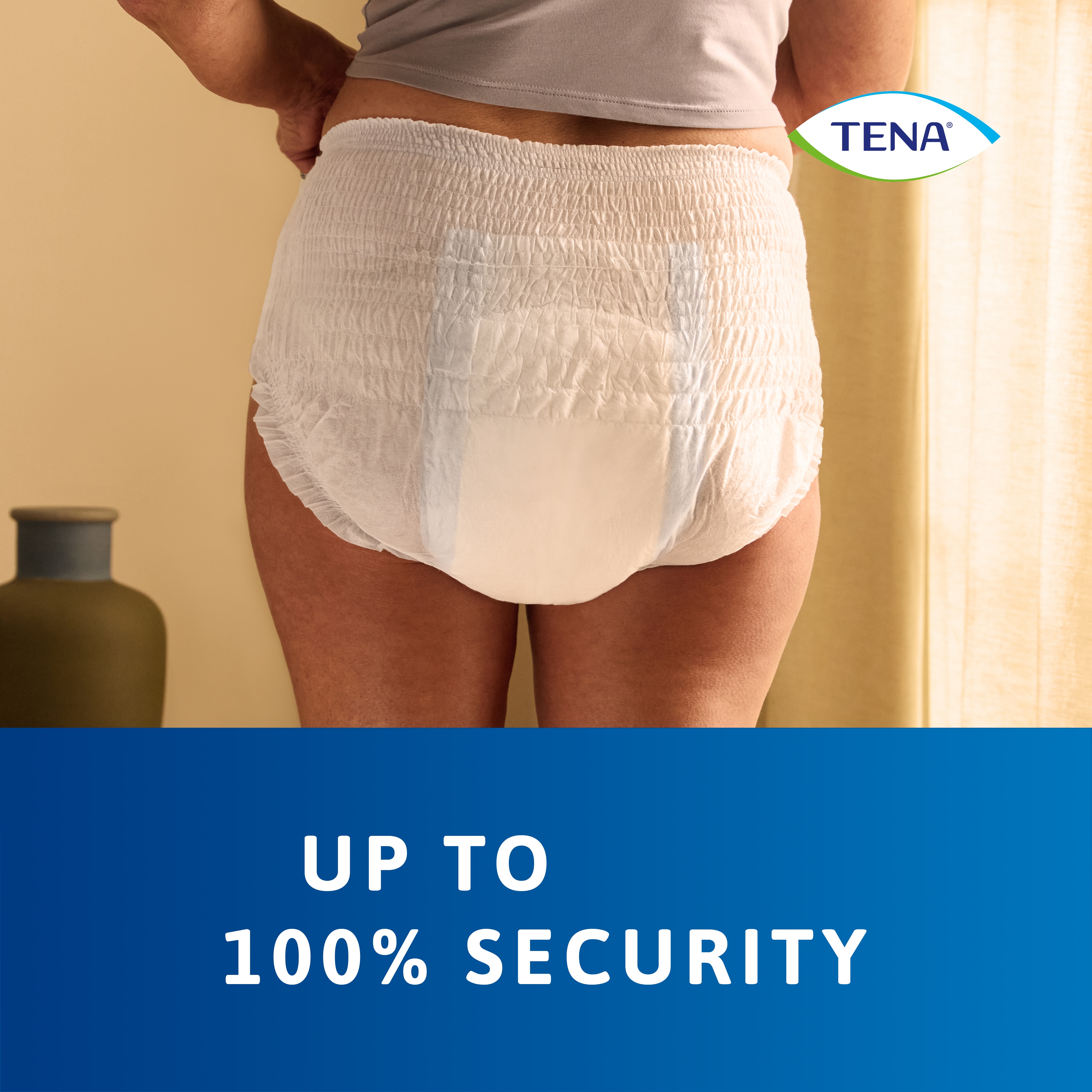 TENA Pants protect+ seen worn on body from behind highlighting the up to 100% security it offers