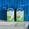 Packs of TENA Discreet Ultra Pad Mini and Normal on a sideboard