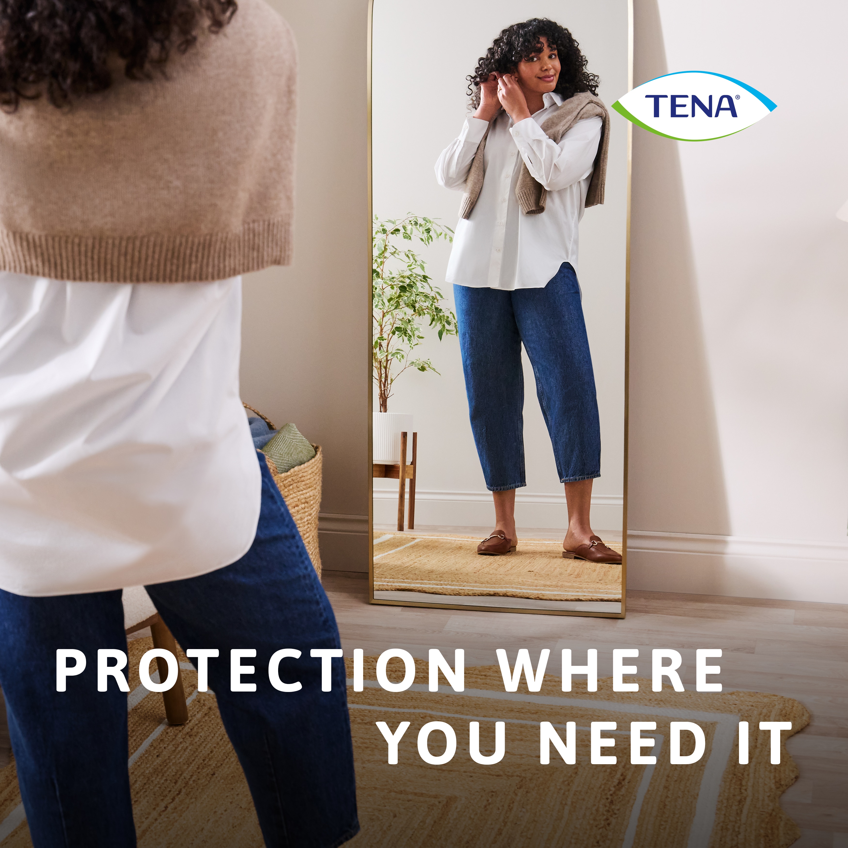 Woman standing in front of mirror, dressed, with the caption "Protection where you need it"