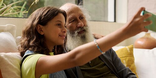 Grandfather and grandaughter taking a selfie