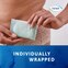Woman holding TENA Discreet Ultra Pad which is individually wrapped.  Woman holding TENA Discreet Ultra Pad which is individually wrapped.