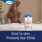 TENA Lights Sensitive Normal pad displayed with a woman putting on clothes, with the caption "kind to skin. Protects like TENA" 