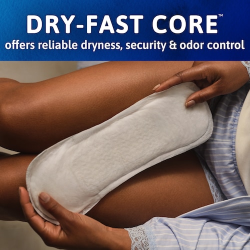 Woman holding the Sensitive Care pad with both her hands. The caption says" Dry-Fast core offers reliable dryness, security and odor control".