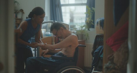 Woman Helps Man