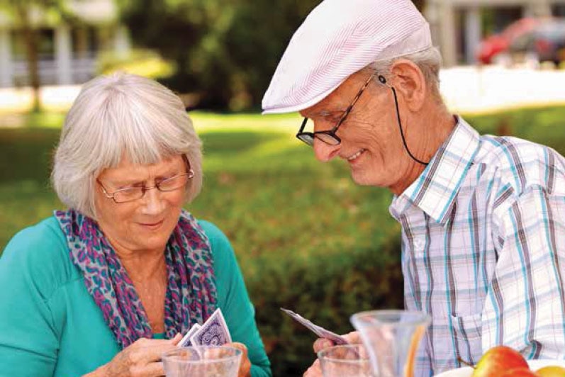 Image of Husband and Wife Playing Cards
