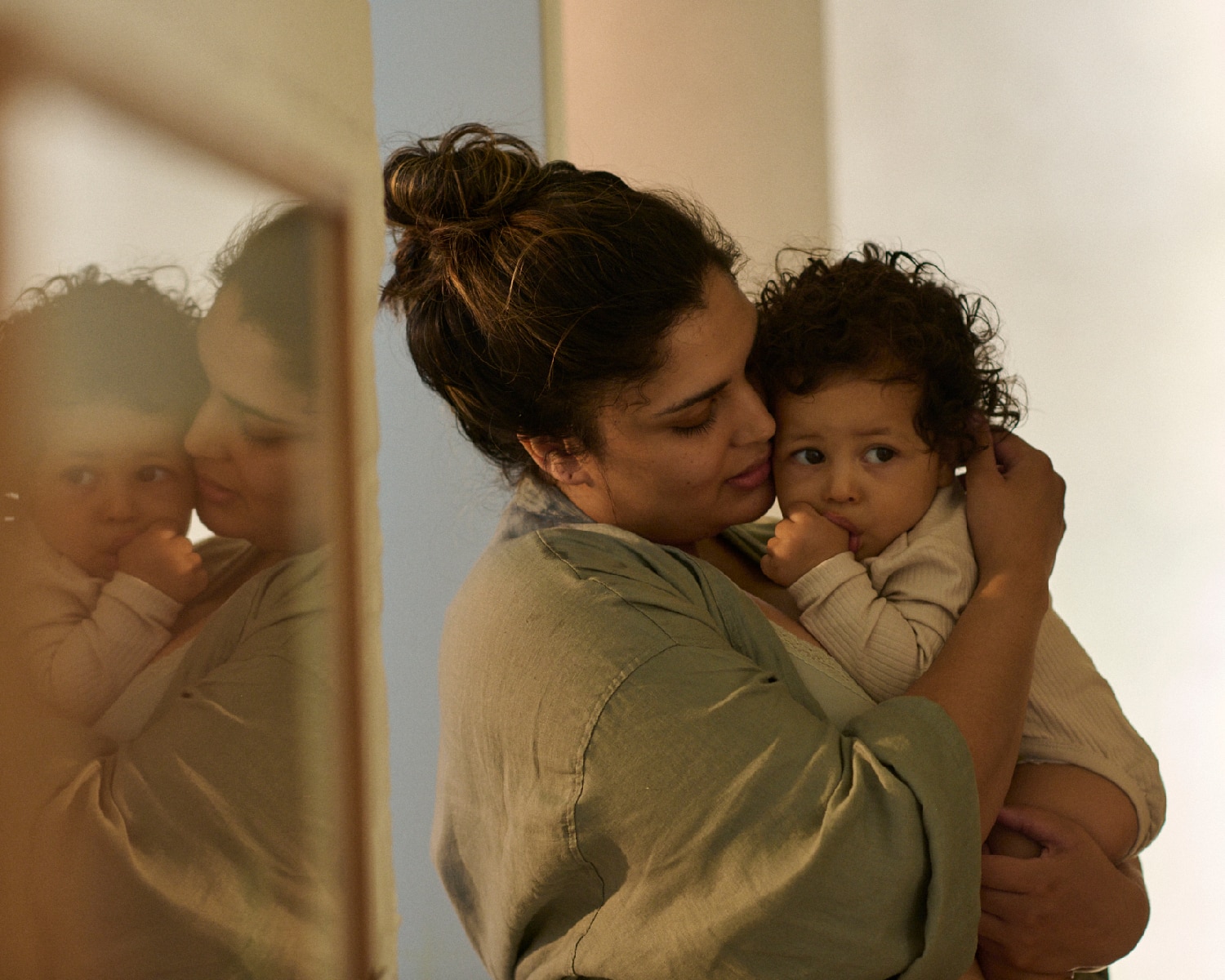 Mother cuddling with her baby