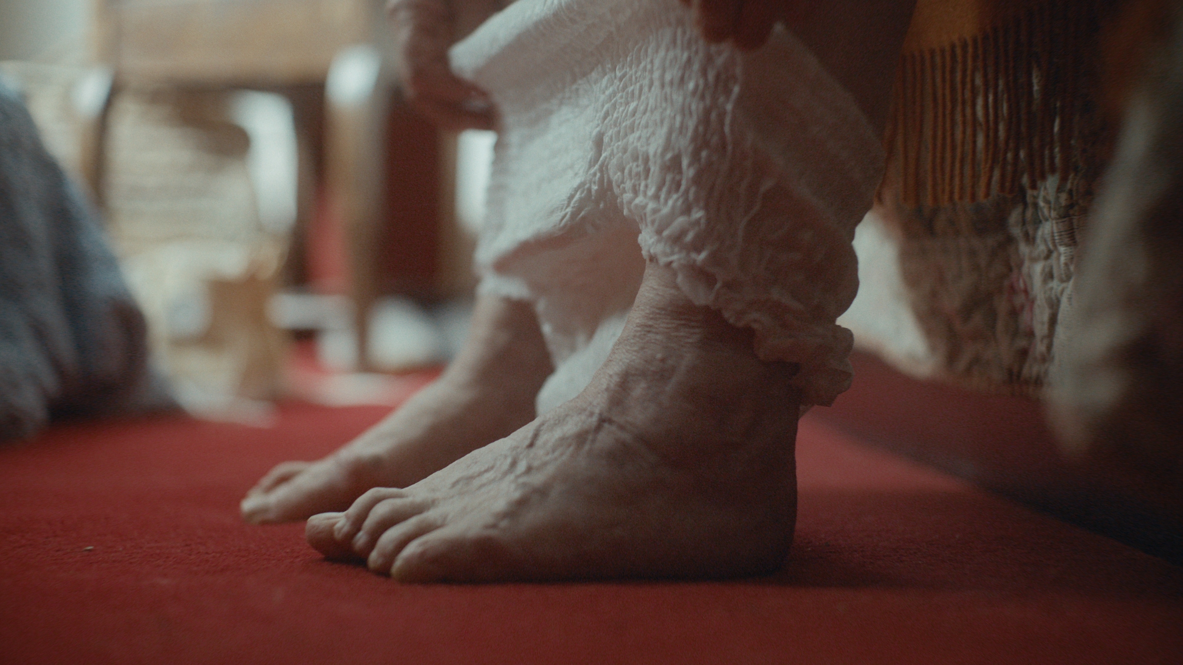 Older woman putting on TENA pants