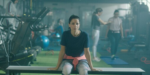 Woman sitting in a gym