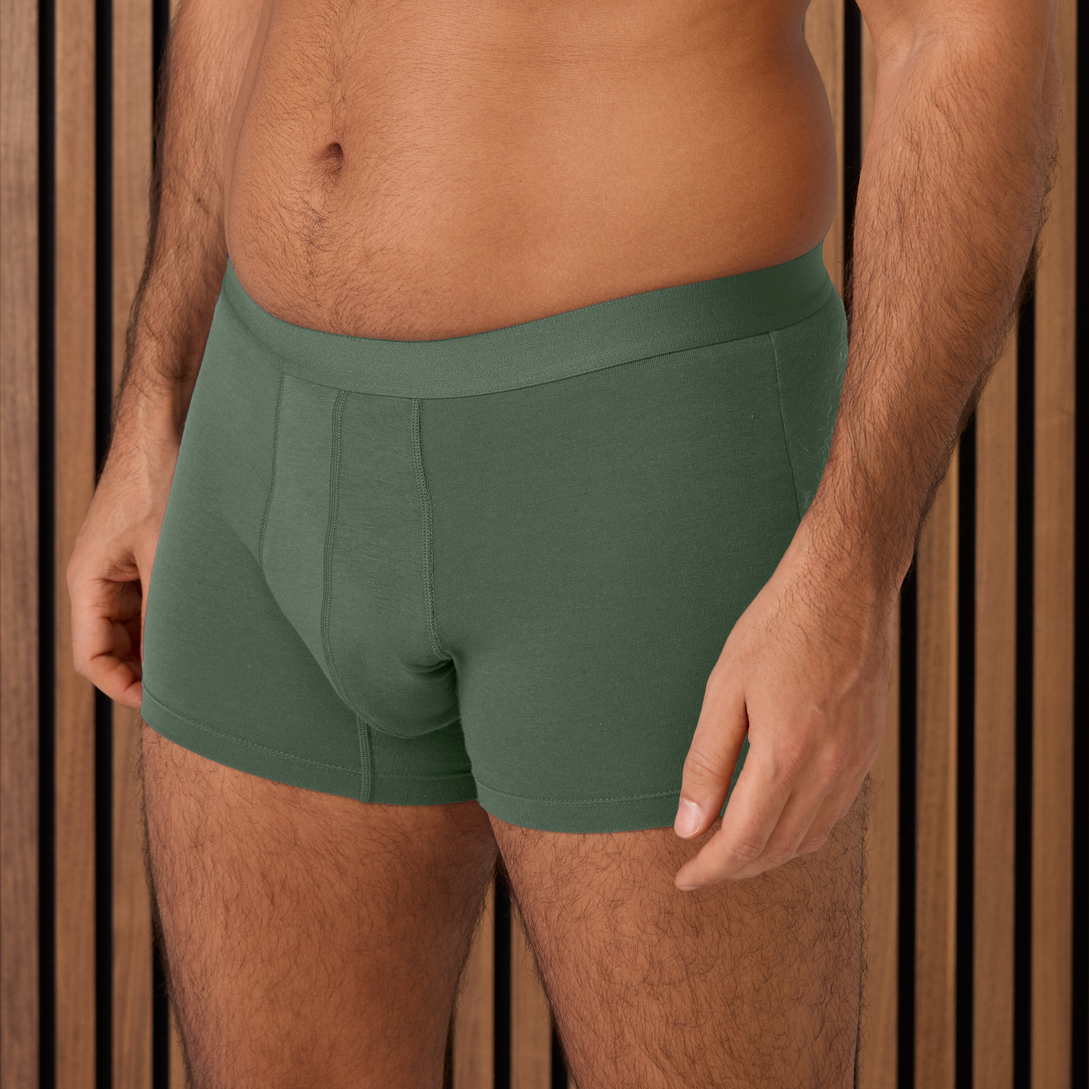 Man wearing TENA Men Washable Protective incontinence Boxer - in green color