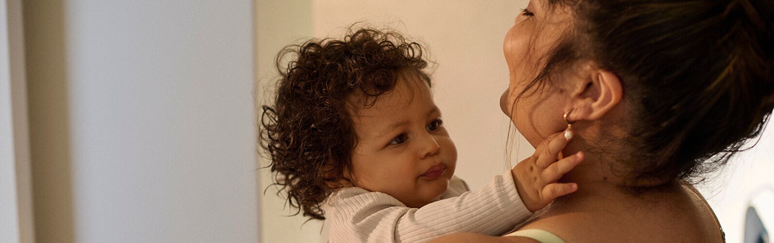 Mother cuddling with baby