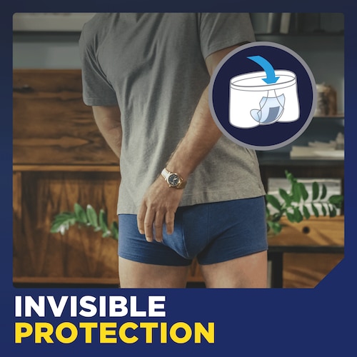 A person wearing the TENA Men Protective Shield Light  inside boxers demonstrating the invisible protection that it provides