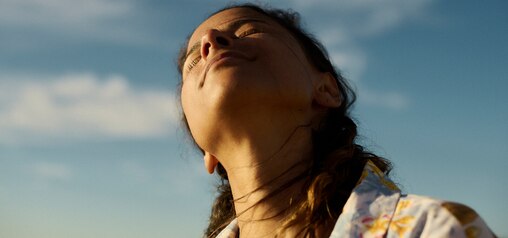 Close up woman facing the sun