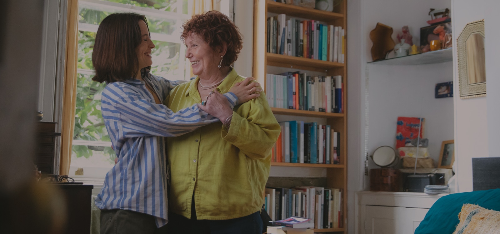 A daughter hugs her mother
